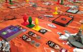 red, green and yellow plastic astronaut figures on a Mars board game