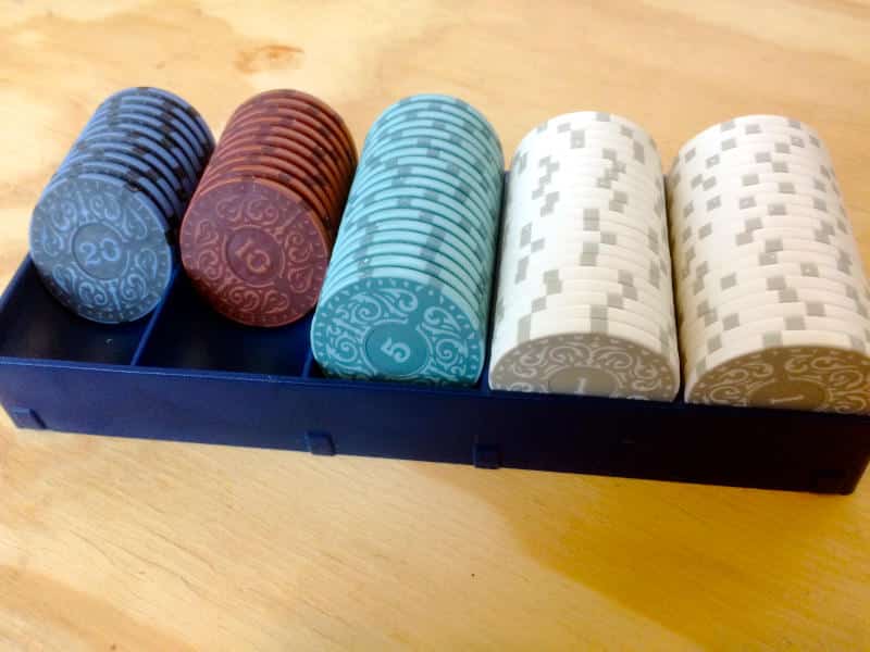 five rows of poker chips of different values