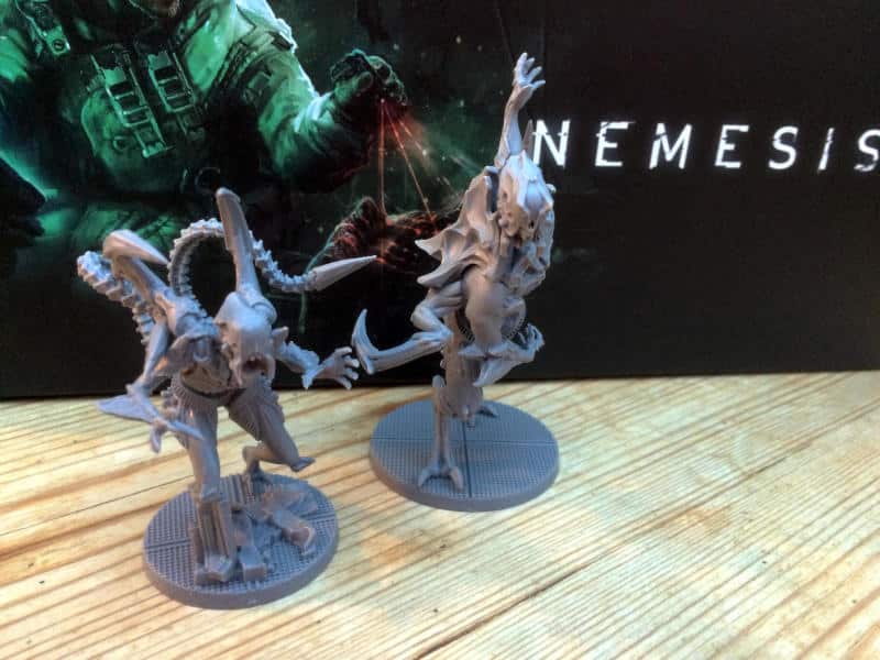 Nemesis alien miniatures in front of box