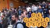 crowds descend steps to the entry of UK Games Expo 2022 Hall 1