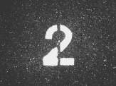 the number 2 printed in white on grey astroturf (Photo by Possessed Photography on Unsplash)