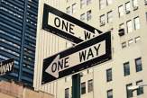 two one way signs pointing in different directions (Photo by Brendan Church on Unsplash)