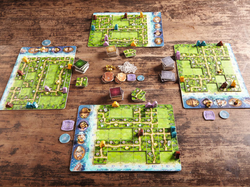 four game boards, the temple scoring tiles and other components from Karuba (Photo courtesy of Haba)