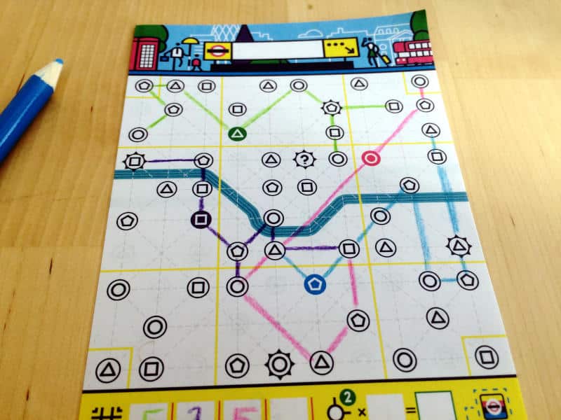 one of the player sheets in Next Station: London and a blue colouring pencil