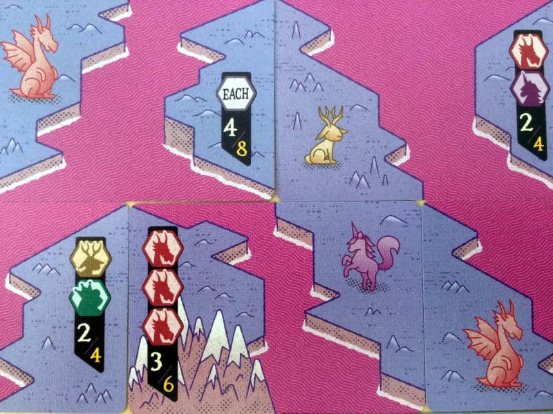 a close-up of some of the cards showing the river enclosing islands with animals and scoring conditions on them