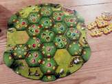 a player board almost filled with hexagonal apple orchard tiles