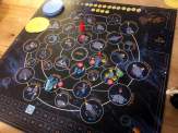the game board of Starry Night Sky with the made-up constellations, gem star tokens, plastic telescope player pawn and other components