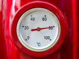 closeup of the thermometer of a red electric