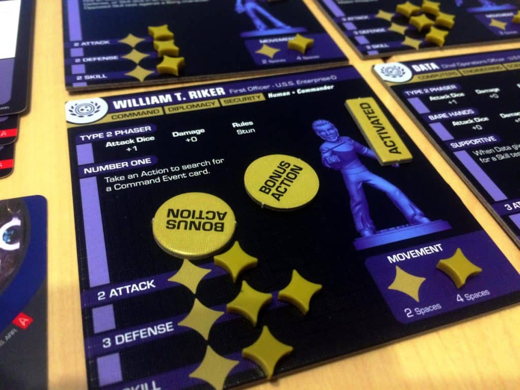 a close-up of Riker's character board with the tokens and the fiddly stats counters
