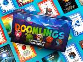 the box of Doomlings on top of a number of Doomlings cards