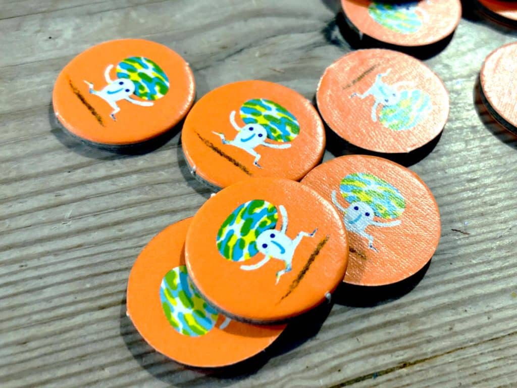 the circular, orange cardboard food markers from Prey Another Day