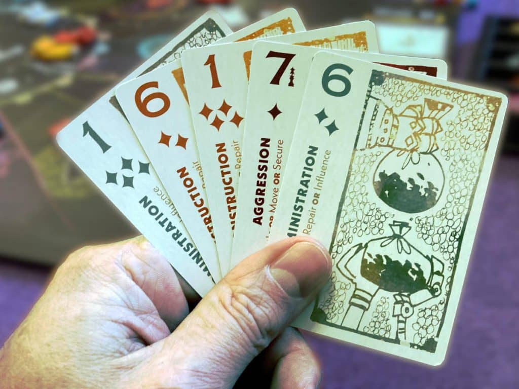 five Arcs cards held in a fan