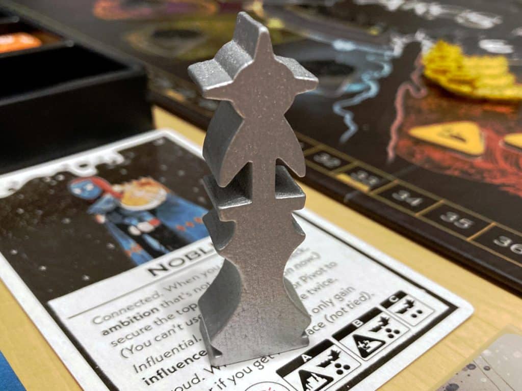 the silver wooden first-player marker from Arcs