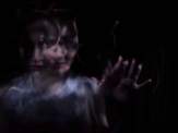 blurred outline of woman on dark background