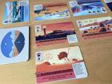 the deck of cards, a revealed card, two journey rows and a scrapbook deck from Death Valley: Highs & Lows
