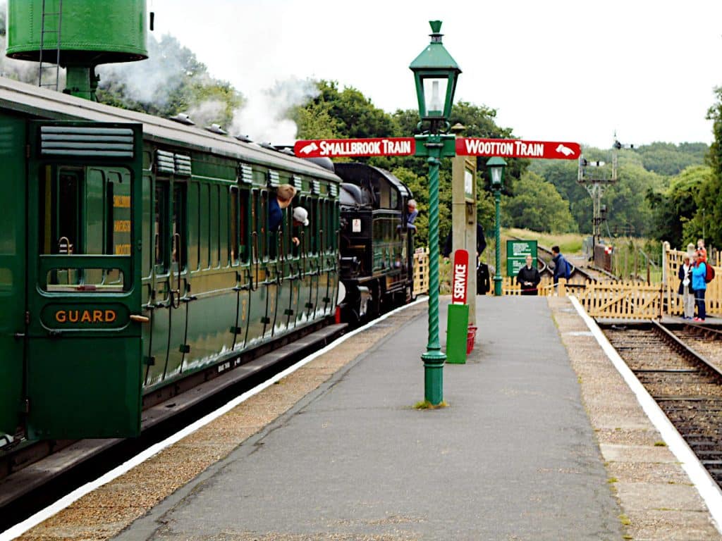 a photo of a heritage Isle of Wight train waiting at a station