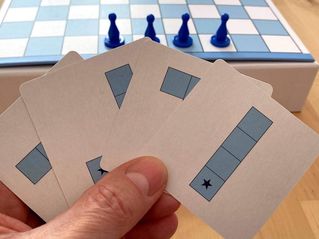 a close-up of four movement cards