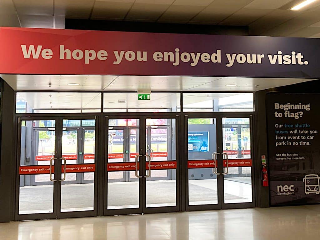 the main exit of the NEC with the words "We hope you enjoyed your visit." above the doors