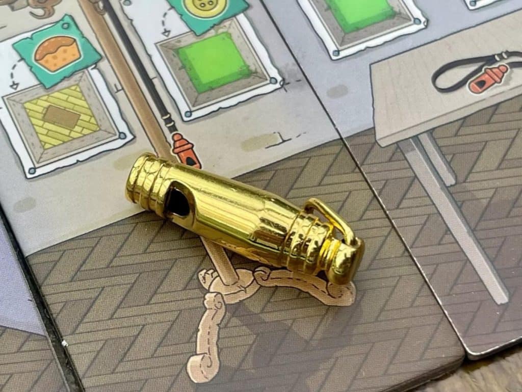 the gold whistle that Fled comes with on top of some of the tiles