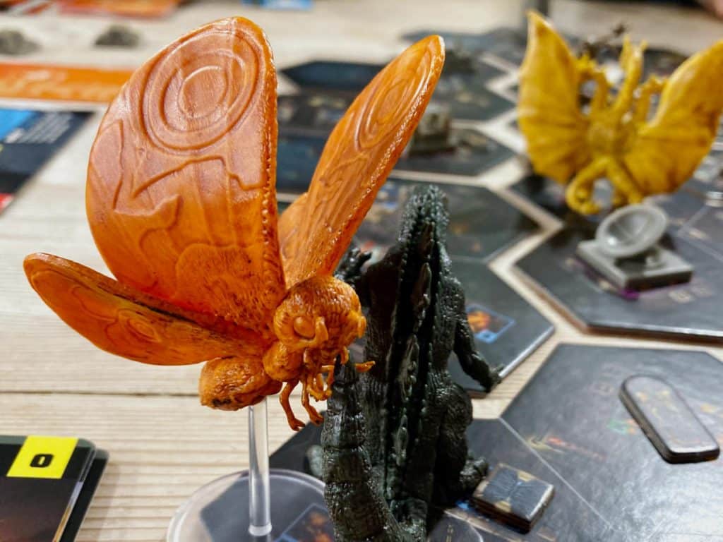 Mothra, Godzilla and Megalodon miniatures on the modular game board