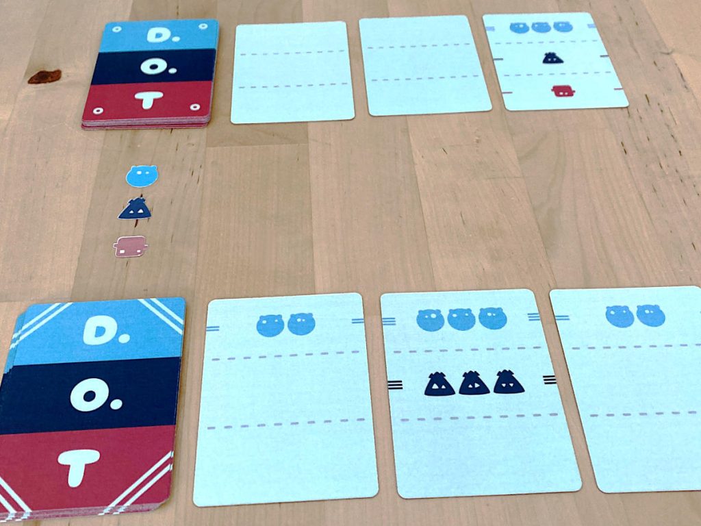 the two decks from D.O.T and three cards from each player laid out on the table