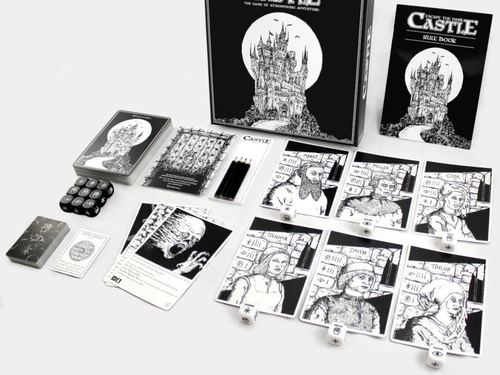 cards, dice and other components from Escape the Dark Castle laid out on the table