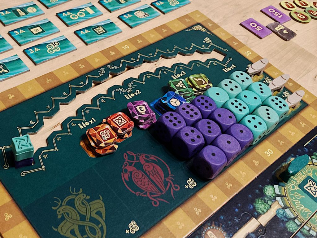 nine dark purple and nine cyan dice, a number of gem cardboard tokens and various other components from The Druids of Edora