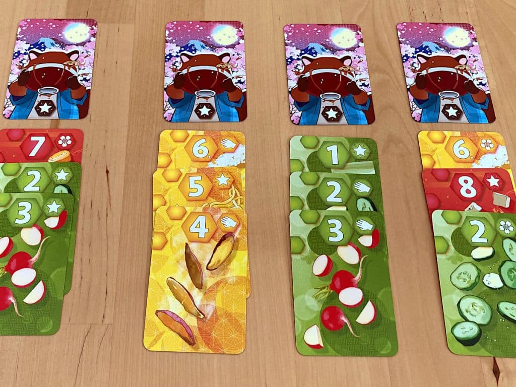 four dishes made up of three ingredient cards